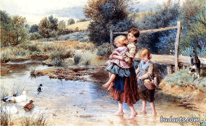 在小溪里划水的孩子们