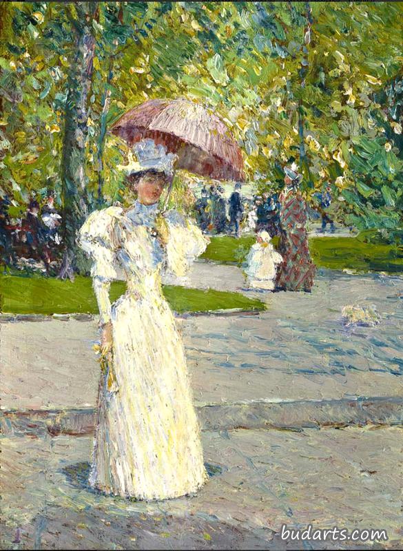 公园里拿着阳伞的女人