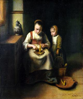 一个女人在刮防风花，旁边站着一个孩子