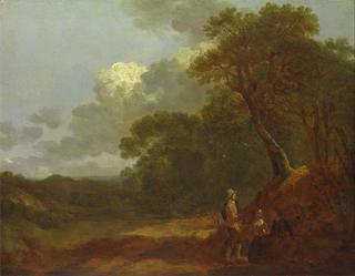 一个男人和两个坐着的女人聊天的森林景观