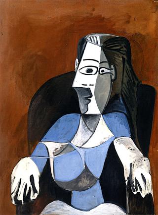 Woman Seated in a Black Armchair