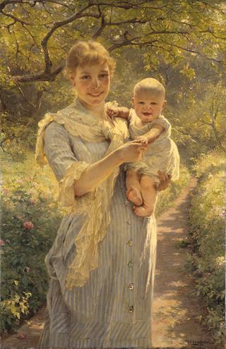 Young Mother With Her Child In The Garden