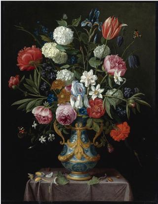 Still life of irises, peonies, narcissi, tulip and other flowers in a blue-and-white porcelain vase