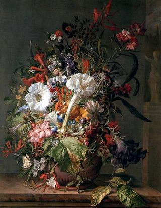 Flowers in a stoneware vase on a marble ledge