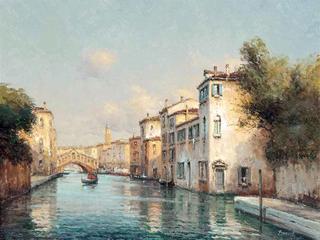 A gondola on the Grand Canal, the Rialto Bridge beyond, Venice