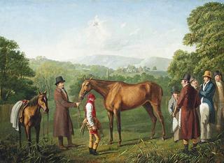 A bay racehorse held by a trainer in an extensive landscape, with a jockey and other figures nearby