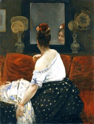 Woman from the back in front of a mirror