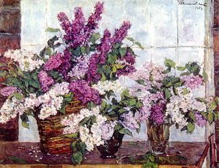 Lilac, crystal vase and a basket