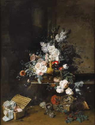 Still life with a basket of flowers and a box of ribbons