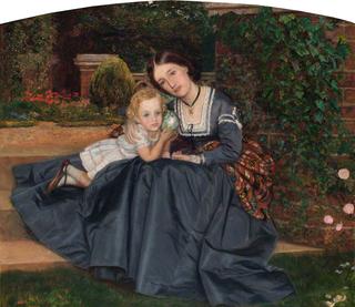坐在花园里的母亲和孩子