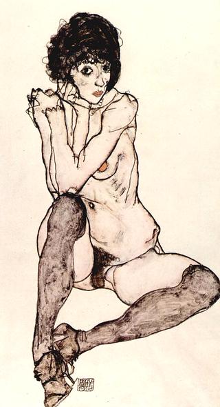 Seated female nude with elbows propped