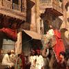 在艾哈迈达巴德的一条街道上散步，由两个仆人牵着国王的大象