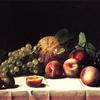 有哈密瓜、桃子和葡萄的静物画