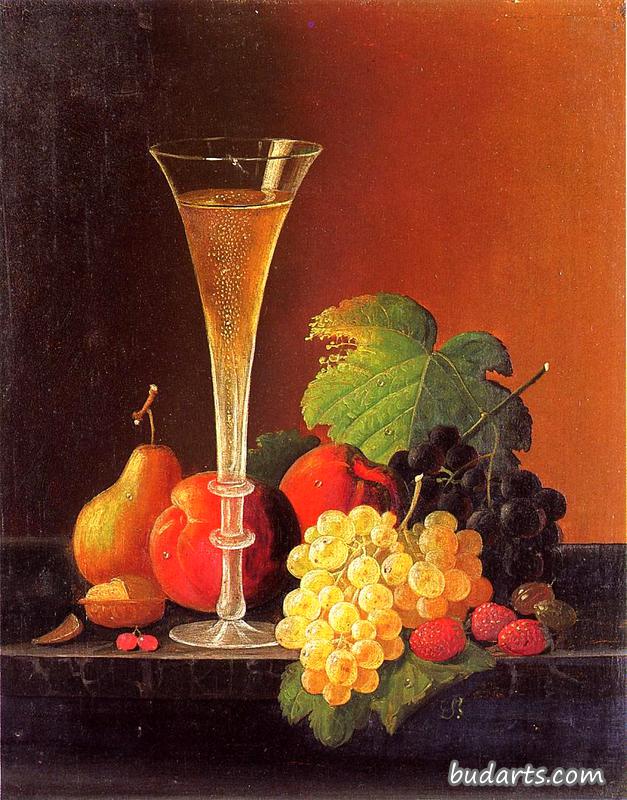 水果和一杯香槟放在桌面上