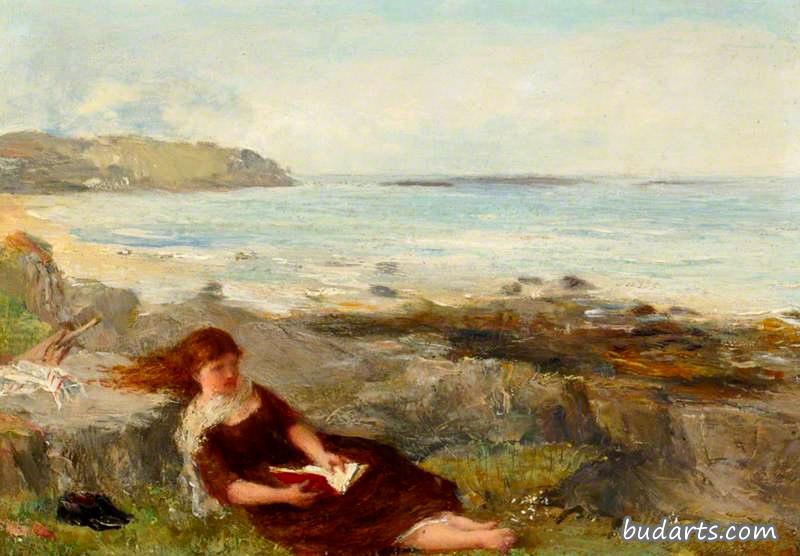 在海边读书的女孩