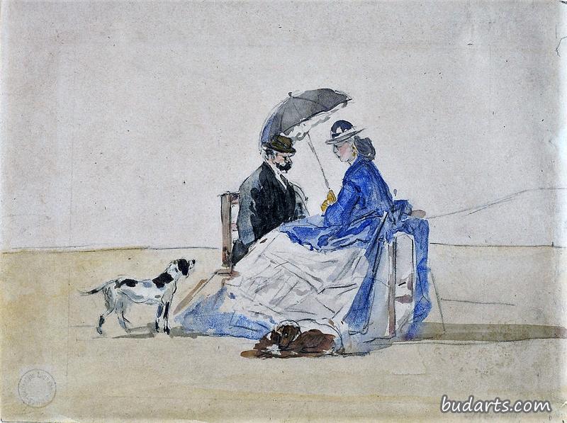 一对夫妇和两只狗坐在海滩上