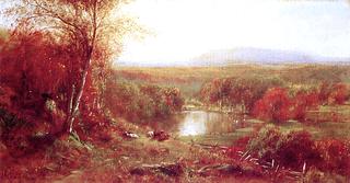 Cows at Res by a Lake in an autumn Landscape
