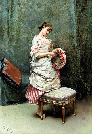 Aline holding a hat