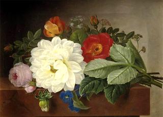 A bouquet of flowers on a marble ledge