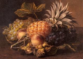 Grapes, a pineapple, peaches and hazelnuts in a basket