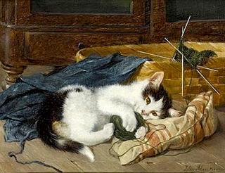 Kitten Playing with a Ball of Wool on a Blue Blanket
