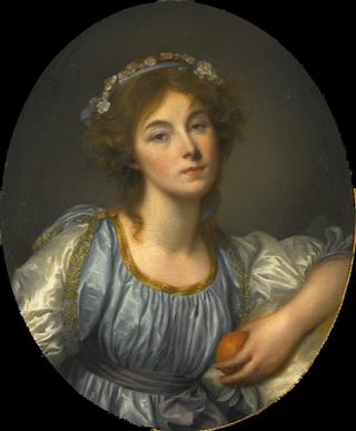 A Young Girl Holding an Orange