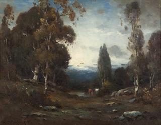 Cows watering in a forest landscape
