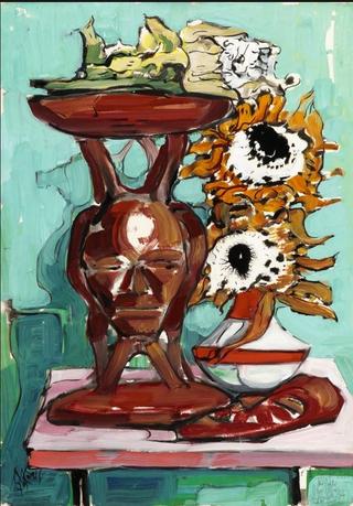 Still life with African stool, mask and sunflowers