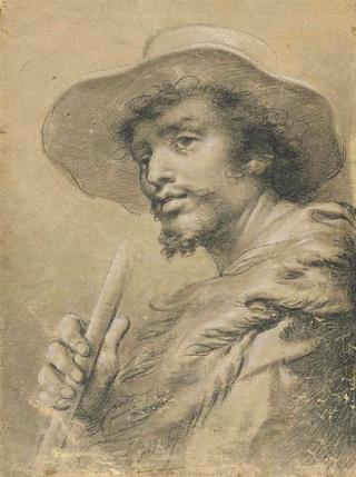 A Man in a Hat and Holding a Staff