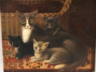 Interior with three kittens and their mother
