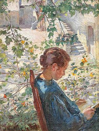 Young Woman reading in Garden
