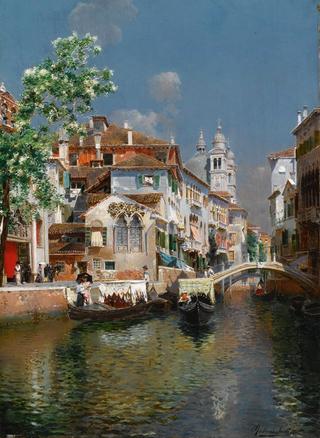 Gondolas on a venetian canal, Santa Maria Della Salute in the distance