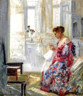 A young woman sewing