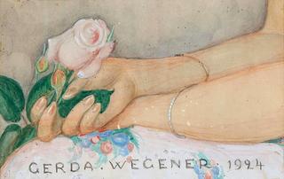 Composition with female hands holding a pink rose