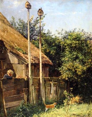 Two Children Looking through a Fence at a Cat