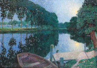 Boat moored by canal