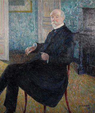 Portrait of man seated in an interior