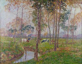 Cows by a small stream