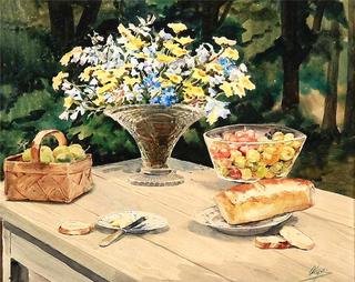Still life with flowers, bread and fruit on a garden table