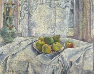 Apples on table cloth againist a lace-curtain window