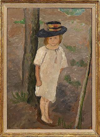 Child at a tree trunk