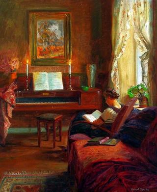 Interior with a woman reading in an armchair