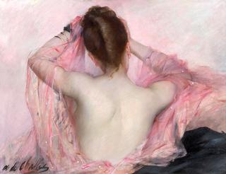 Jeune femme brune au voile rose à sa toilette