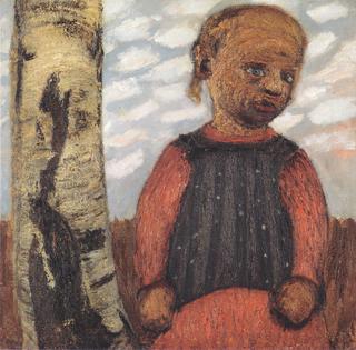 Girl in a red dress by a tree trunk