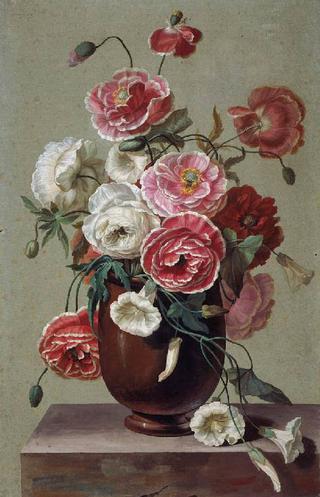 Flowers in a vase on a ledge