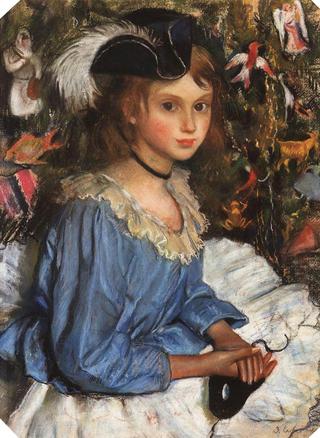 Katya in blue dress by a Christmas tree