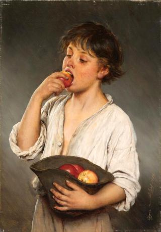 Boy eating an apple