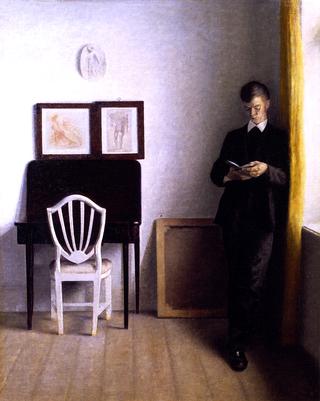 Interior with a Young Man Reading