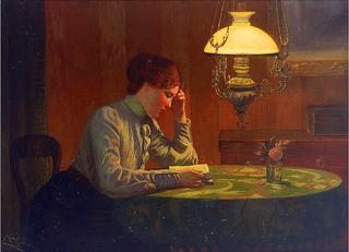 Young woman reading at a table in light of the kerosene lamp