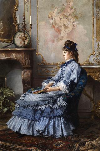 Young lady at the fireplace